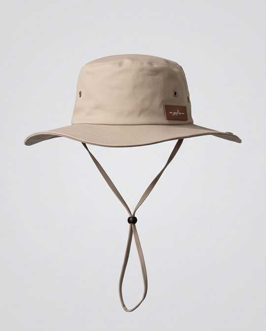 Beige bucket hat with a strap on a light gray background Malibu Beige Bucket Hat With Rope -ماليبو -