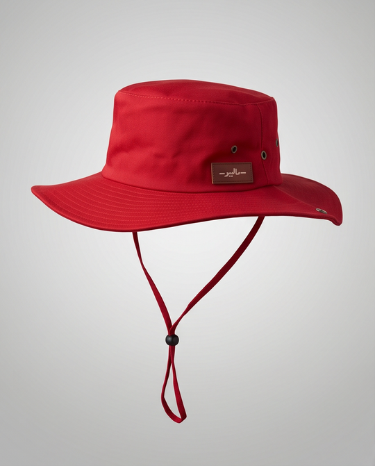 Red bucket hat with a strap on a light gray background