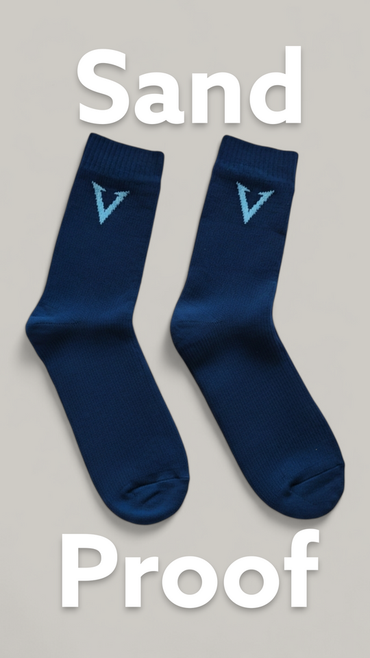 Two blue socks with a logo on a gray background