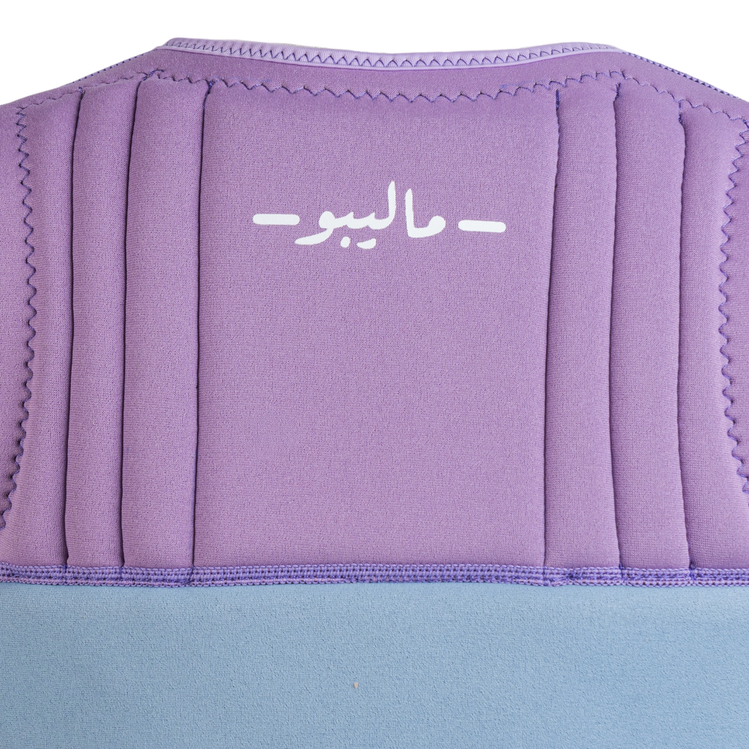 Purple and blue cushion with a brand logo on a white background