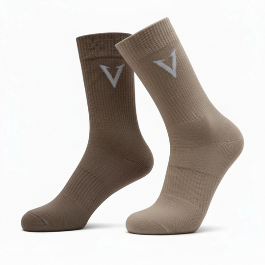 Two pairs of brown socks with a logo on a white background