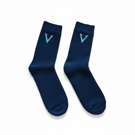 Pair of blue socks with a logo on a white background